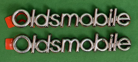 NOS Oldsmobile Nameplate Emblem Adhesive Mount GM 20000969 / 555735–Bundle of 2