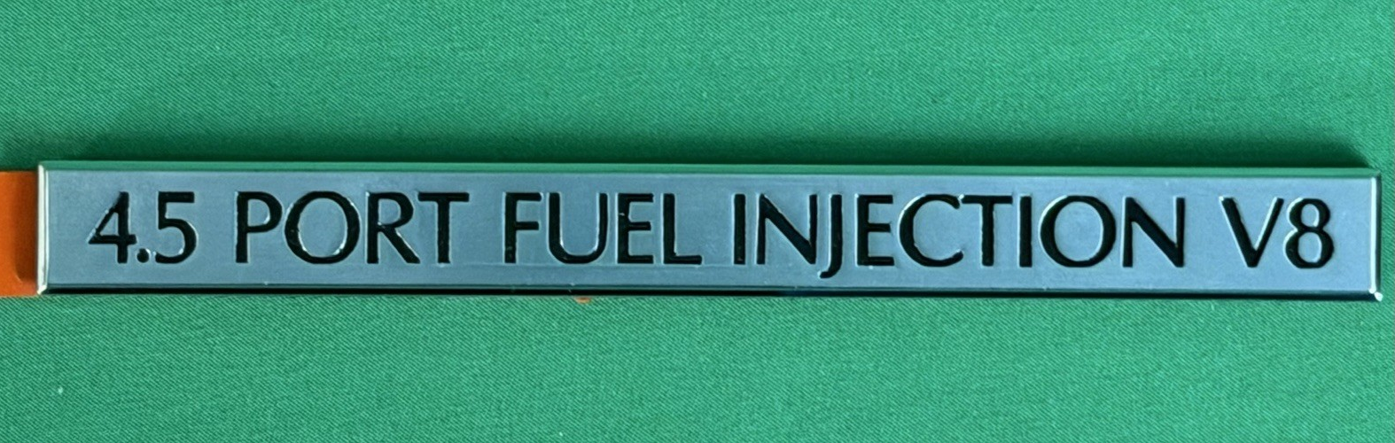 NOS 4.5 Port Fuel Injection V8 Emblem GM 25541014 – Silver - Cadillac