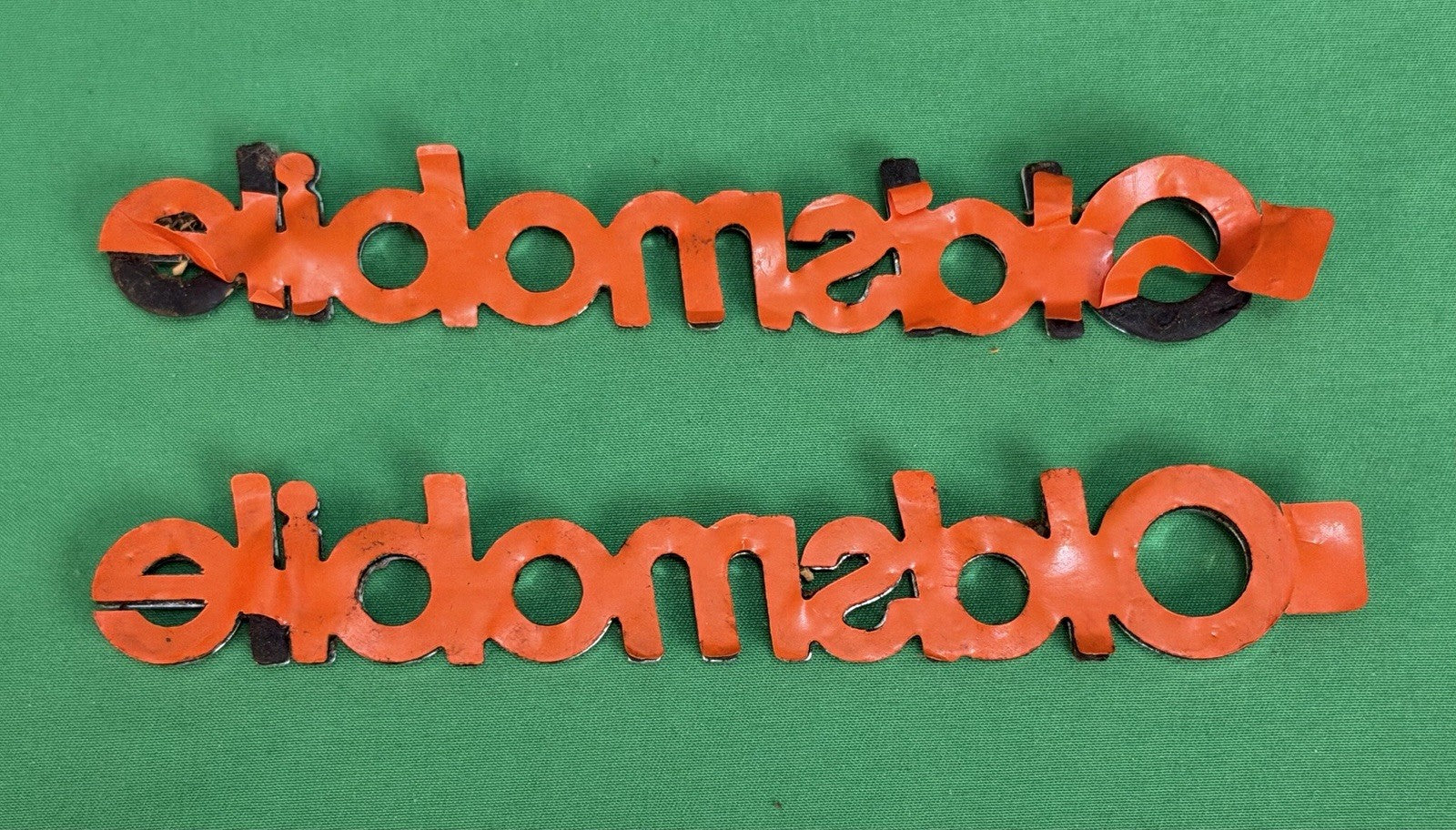 NOS Oldsmobile Nameplate Emblem Adhesive Mount GM 20000969 / 555735–Bundle of 2