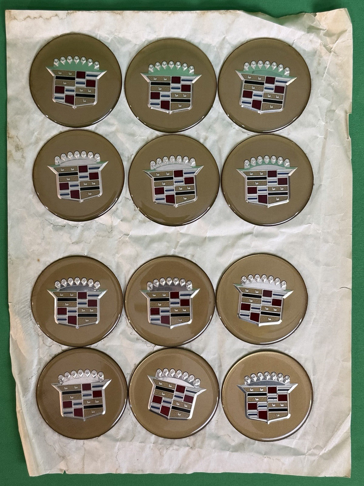 Sheet of 12 Cadillac Gold Crest Wheel Center Cap Medallions / Hubcap Emblems-NOS