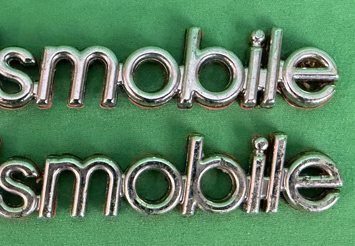 NOS Oldsmobile Nameplate Emblem Adhesive Mount GM 20000969 / 555735–Bundle of 2