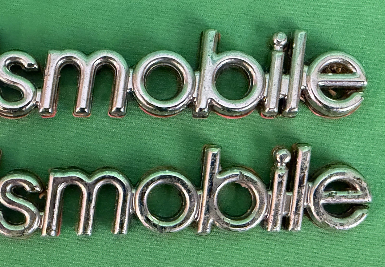 NOS Oldsmobile Nameplate Emblem Adhesive Mount GM 20000969 / 555735–Bundle of 2